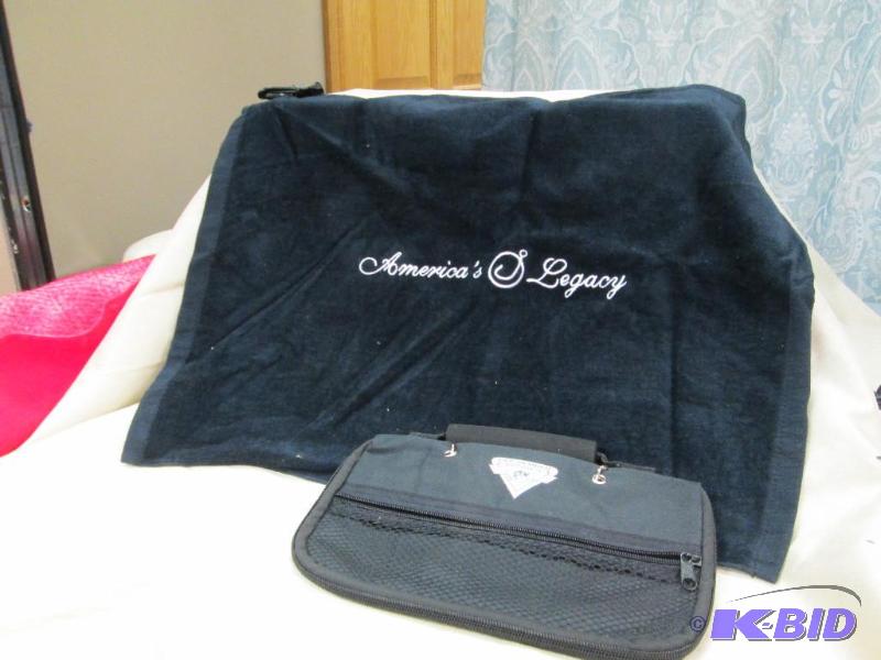 lot 1 image: One fishing golf towel and fishing worm bag...