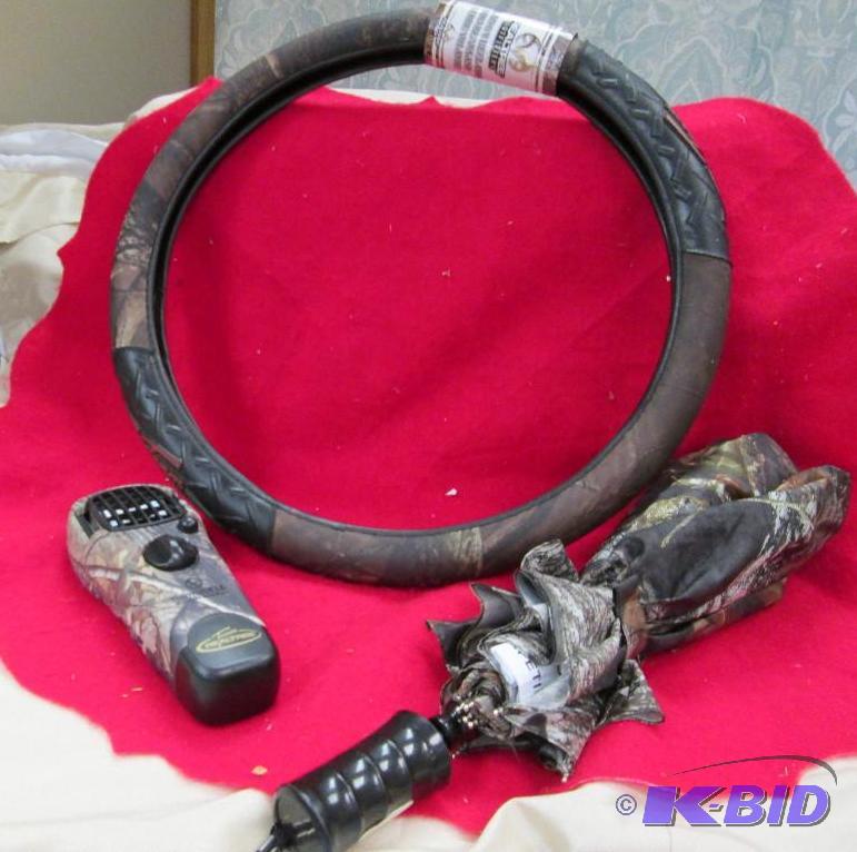 lot 140 image: camo steering wheel cover, umbrella, and Ther...