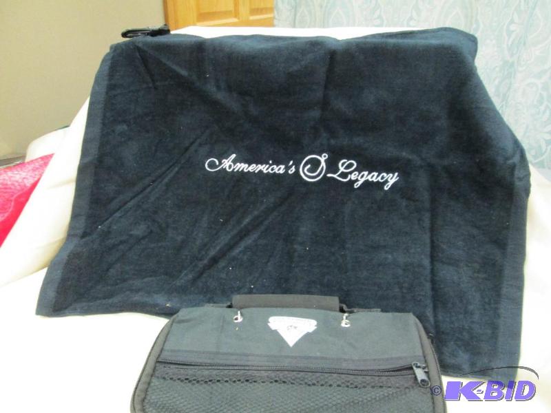 lot 2 image: One fishing golf towel and fishing worm bag...