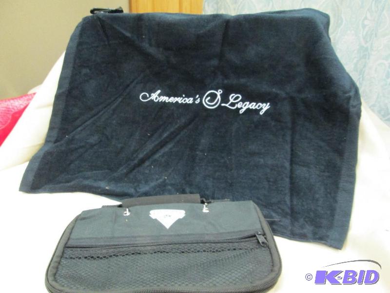 lot 5 image: One fishing golf towel and fishing worm bag...