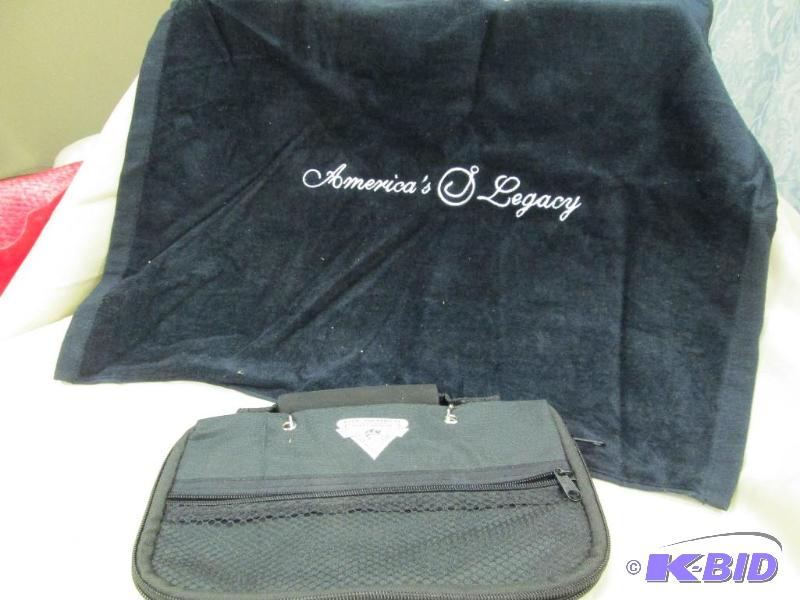 lot 7 image: One fishing golf towel and fishing worm bag...