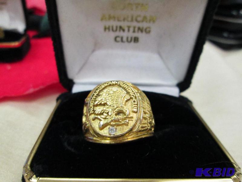 lot 76 image: Mens size 9 ring on top is looks like a eagl...
