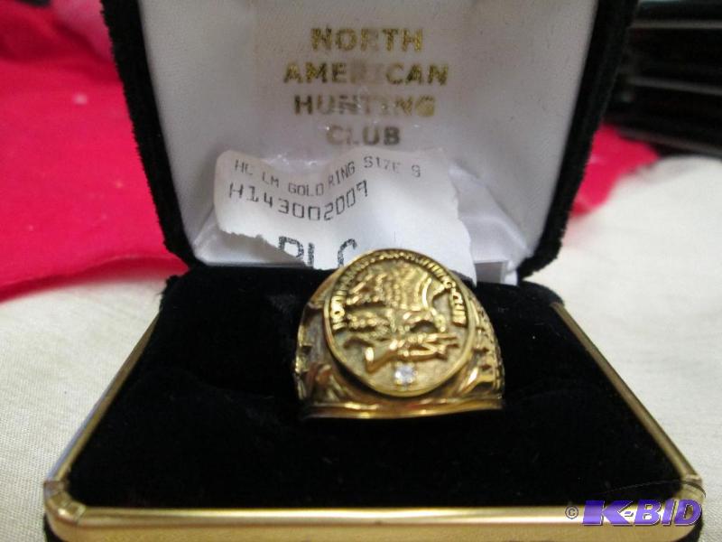 lot 77 image: Mens size 9 ring on top is looks like a eagl...