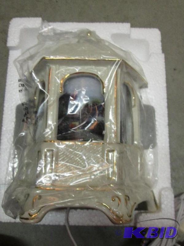 lot 127 image: porcelian garden gazebo with plug in....