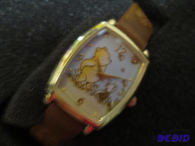 lot 137 image: winnie the pooh wrist watch...