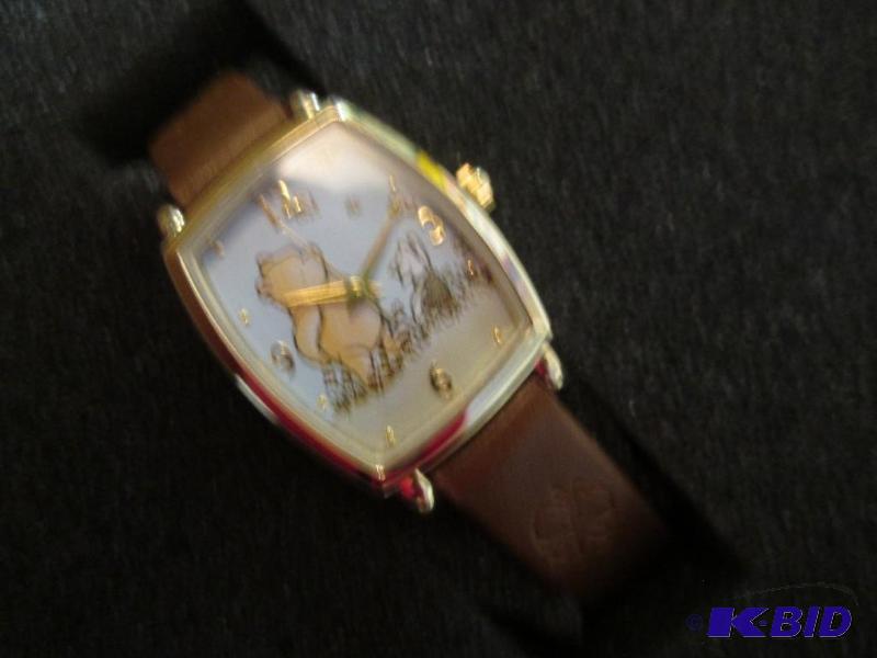lot 140 image: winnie the pooh wrist watch...