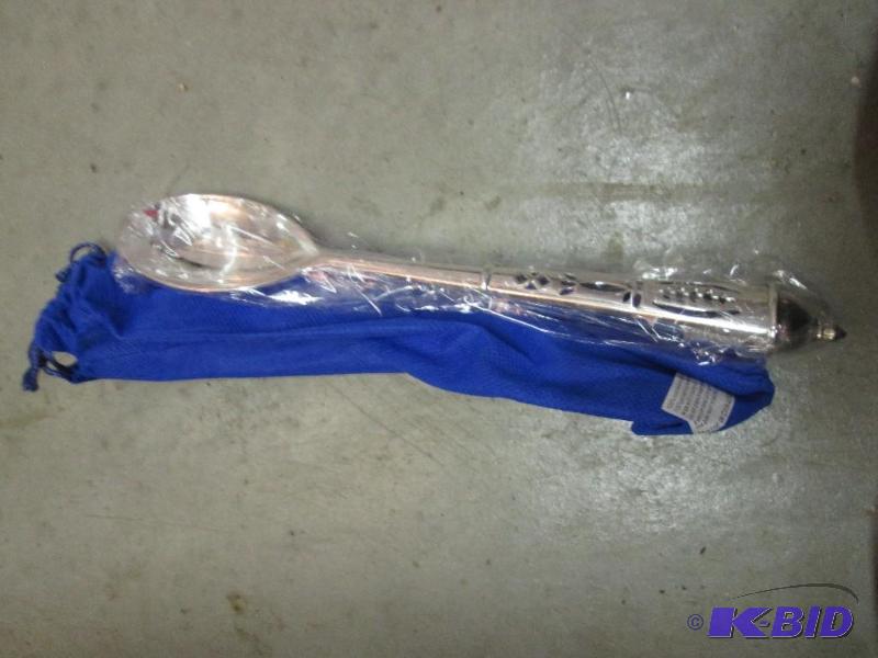 lot 141 image: silver spoon with blue carrying bag...