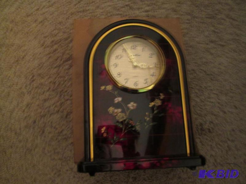 lot 209 image: decorative clock...