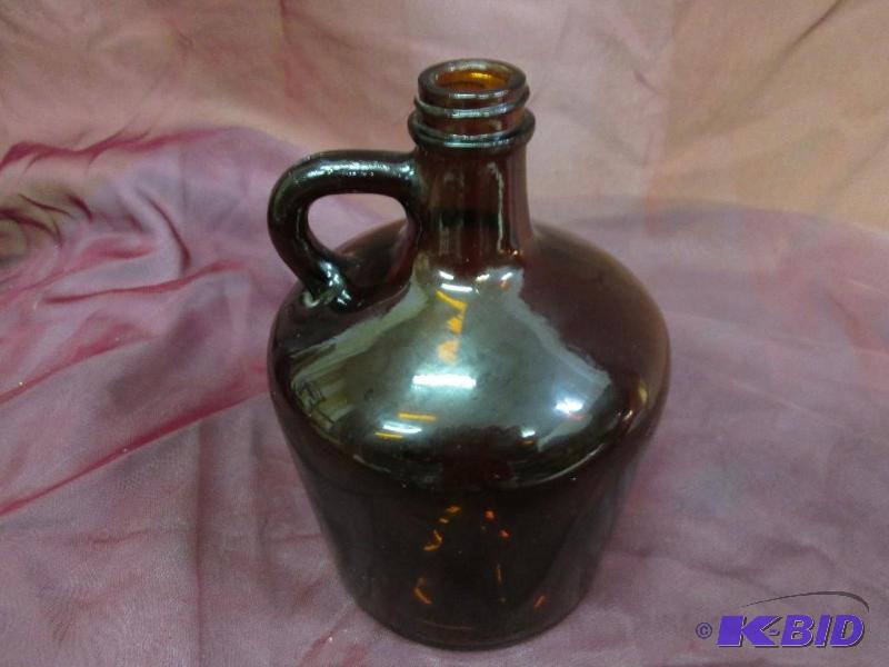 lot 320 image: Brown syrup bottle...