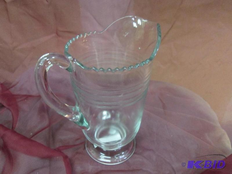 lot 322 image: Clear pitcher with scallop edged top...