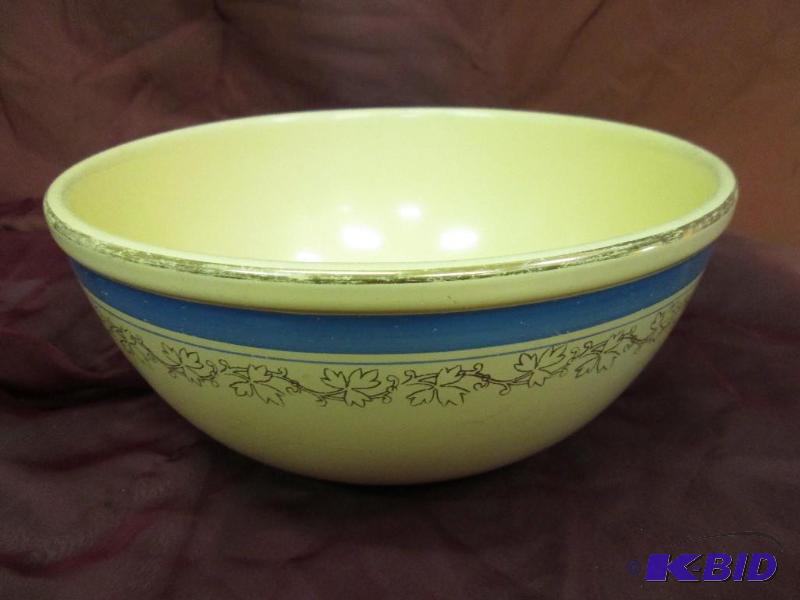 lot 340 image: Tan bowl with blue ring and leaves...