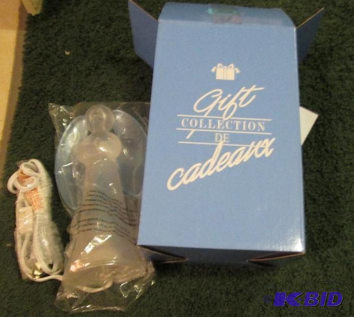 lot 38 image: blessed angle accent lamp Avon 2004...