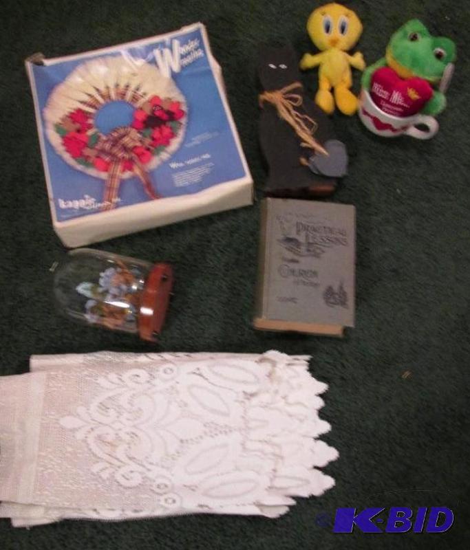 lot 45 image: toys, white cloth, snow globe, and book...