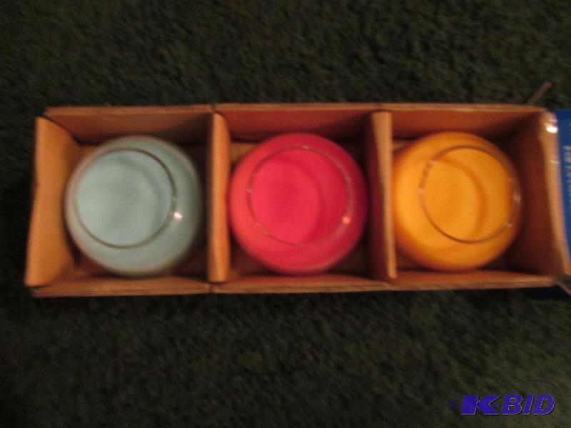 lot 51 image: Avon 2006, color therapy fragrance jars...