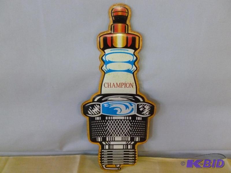 lot 13 image: Champion heavy gage embossed metal sign that ...