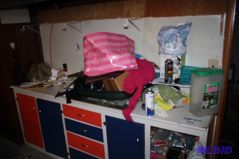 Contents of Shelf Including Box of Bolts, Paints, Stencils, And More.