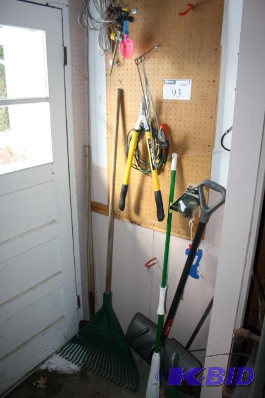Wall Contents Including Shovel, Rake, Tree Shears, And More.