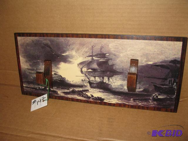 lot 142 image: Display plaque, holds one firearm, ship scene...