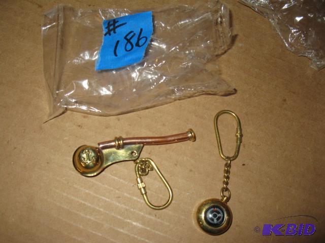 lot 186 image: Navy whistle fob and compass fob, replicas...