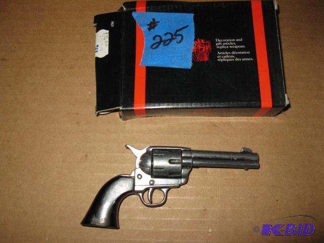 lot 225 image: Mini-replica of old west revolver...