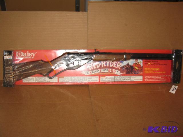 lot 26 image: Daisy Red Ryder BB gun, new in package, wood...
