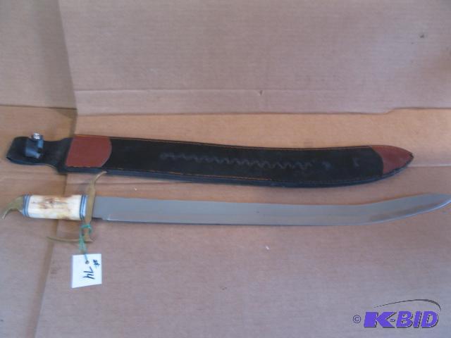 lot 74 image: Curved sword, bone handle in leather sheath...