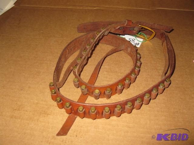 lot 85 image: .22 cal ammo belt, ammo has been struck by fi...