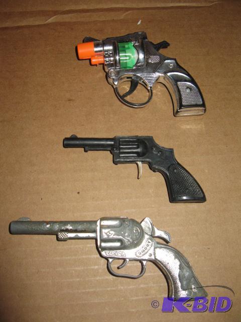 lot 92 image: Vintage toys, 5 inch pistol marked Smokey, 4 ...