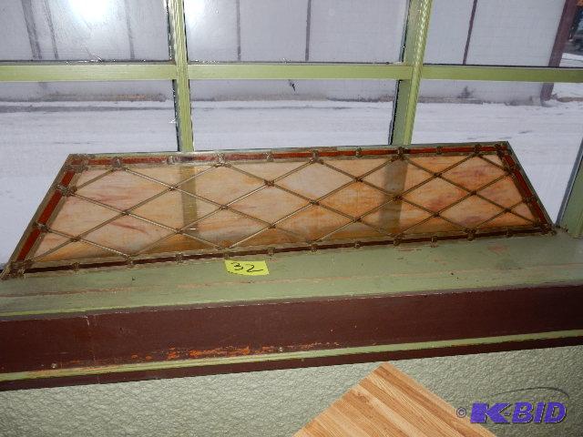 Amber colored stained glass window.. 5 ft wid...