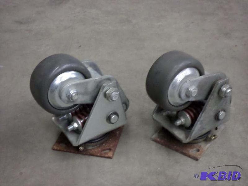lot 100 image: (2) Heavy Duty Spring Assist Industrial Wheel...