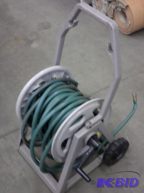 lot 50 image: Suncast Hose Reel With Garden Hose...