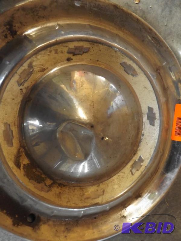 Set of 4 chevy hub caps between the years of ...