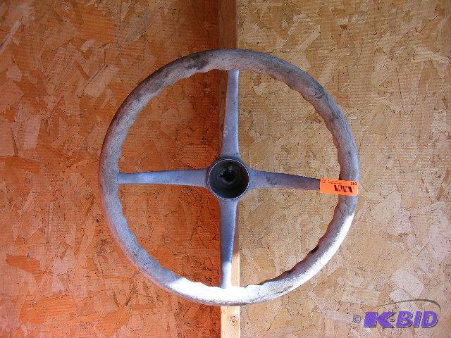 Wood Steering wheel possibly model T. Wood is...