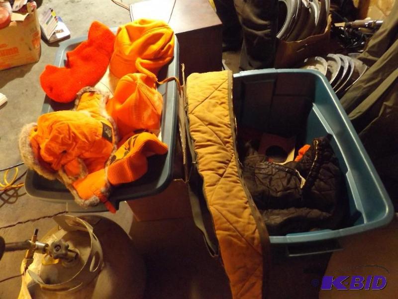 Hunting hats, gun case, gloves and a heat sea...