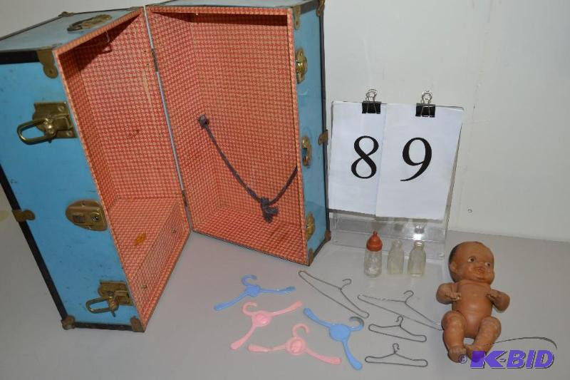 lot 89 image: Vintage black doll, old doll bottles, doll wardrobe and totsy hangers