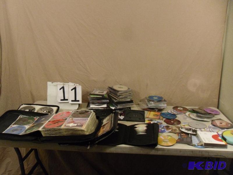 lot 11 image: Large Lot of Assorted CDs and Games. Some may...