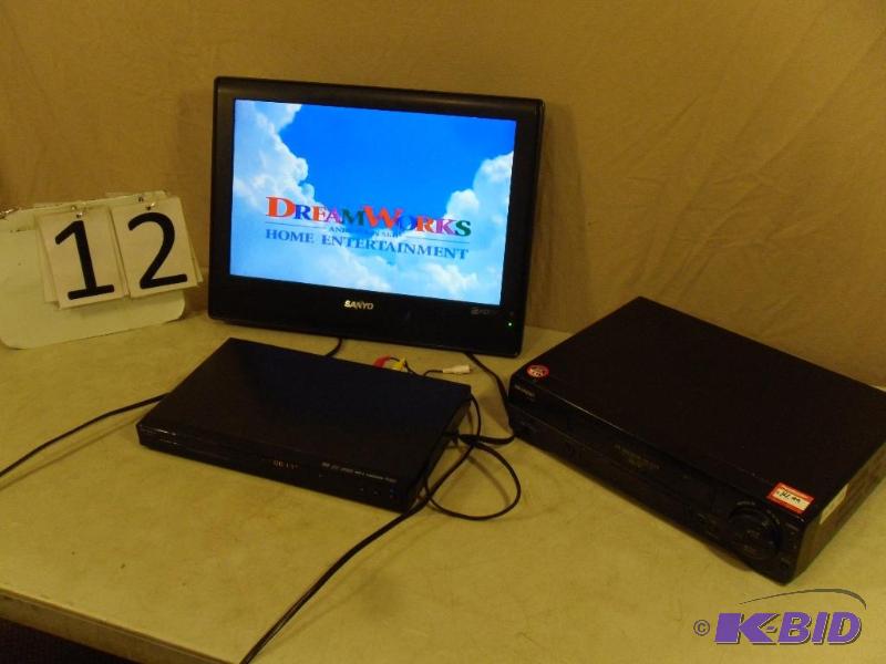 lot 12 image: 19" Flat Panel TV, DVD player, VCR. TV h...