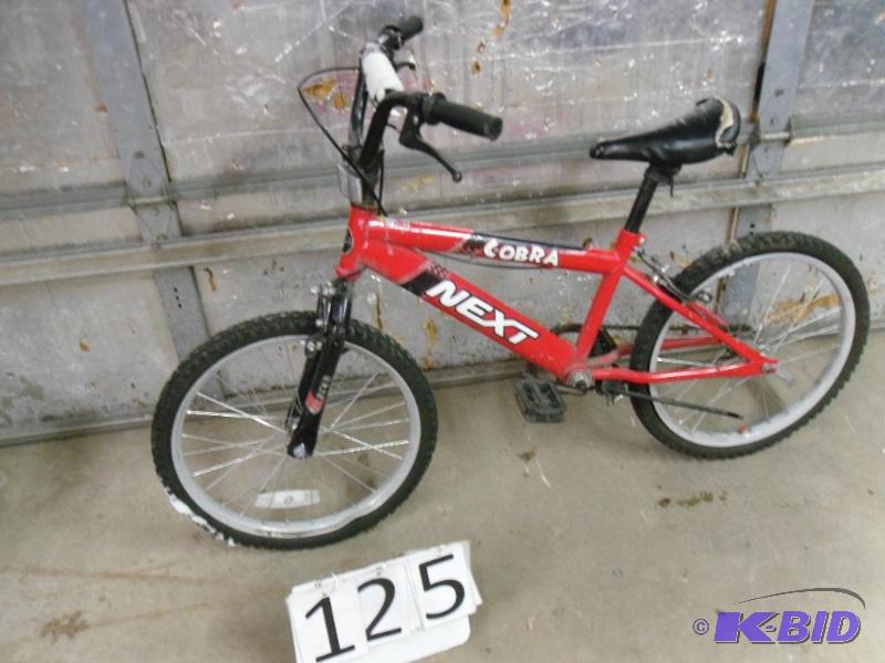 lot 125 image: Next Cobra 20" bike. Front wheel is dama...