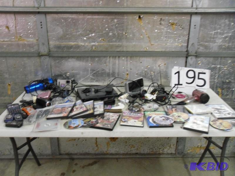 lot 195 image: Dvd Player, Ipod Cords, Dvds, Cds, Alarm Cloc...