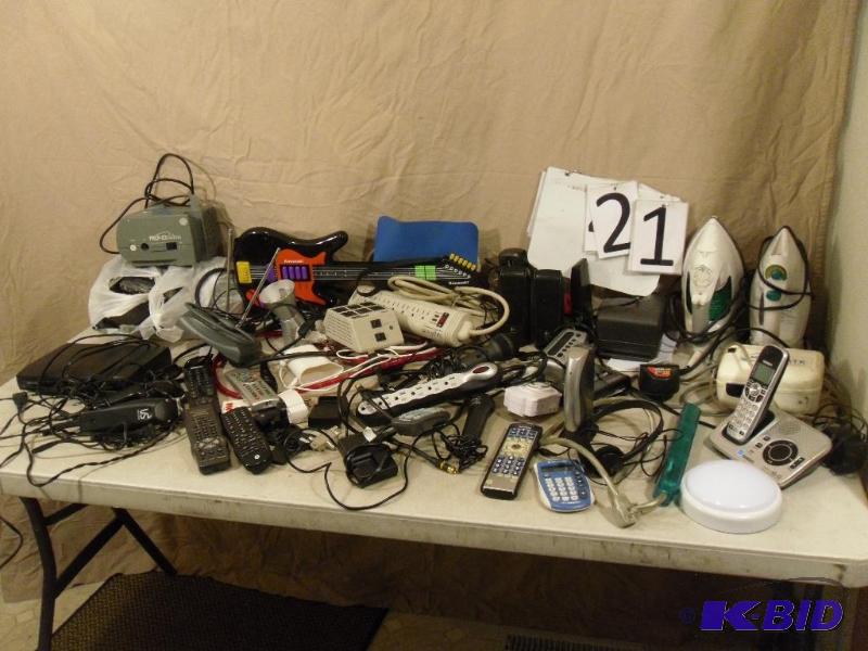 lot 21 image: Assorted electronics. Speakers, remotes, powe...