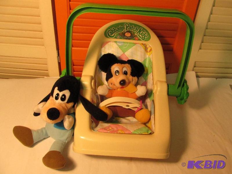 lot 21 image: Cabbage Patch Doll Carrier - comes with Mickey Mouse and Goofy