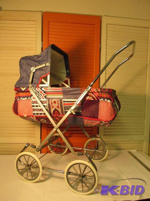 lot 26 image: Vintage Doll Buggy - Bright Colors