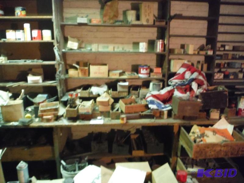 lot 1665 image: Contents of Bench Including Flag Metal Hardware Canisters And More.