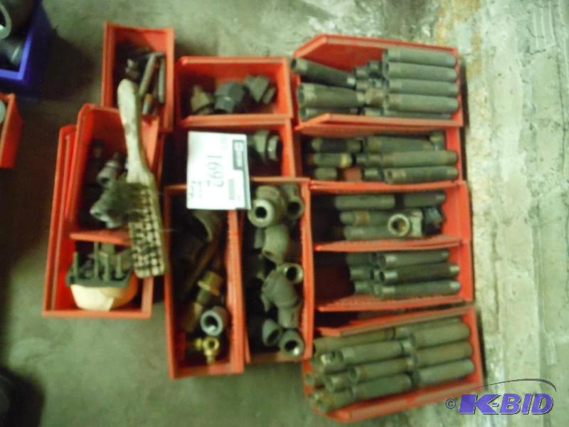lot 1692 image: Metal Pipe Bends, Threaded Straight Piping, Adapters, Plastic Containers, And More.