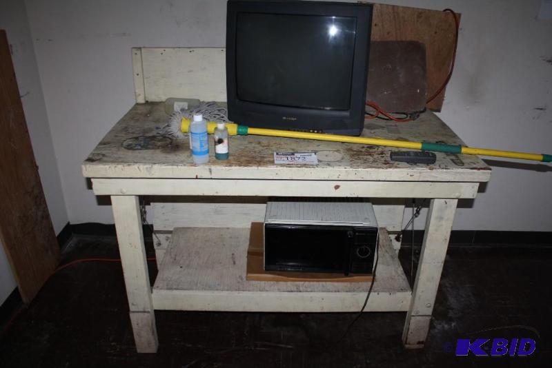lot 1872 image: Work Table Including Contents Samsung Microwave Sharp TV Mop And More.