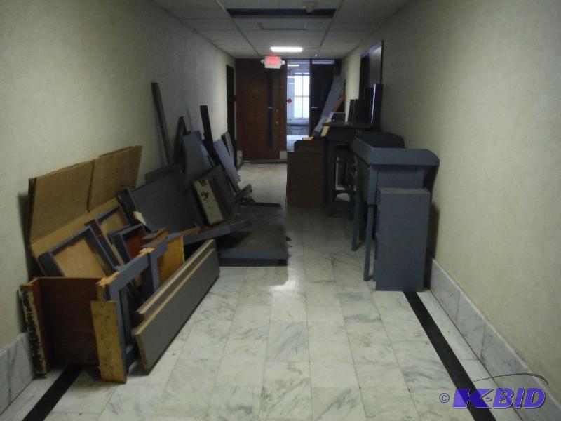 lot 1954 image: Hall of 11th Floor Lot Miscellaneous Work Benches & Desks.