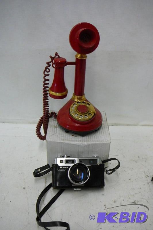 lot 22 image: The candlestick telephone Deco-Tel Model #146...