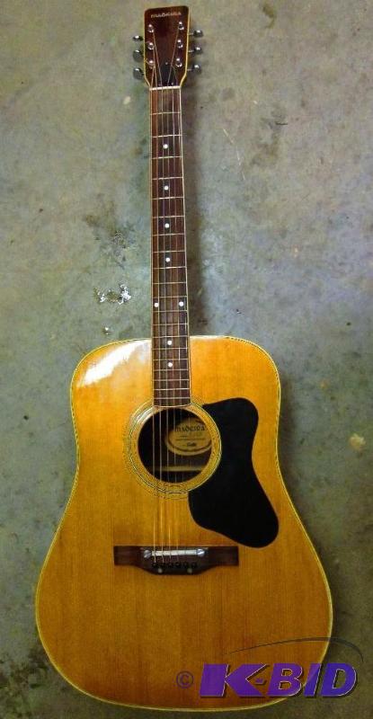 lot 7 image: Nice Maderia 6 string acoustic guitar in good...