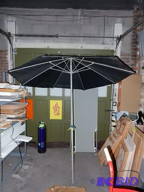 Patio umbrella.. Black colored light filterin...