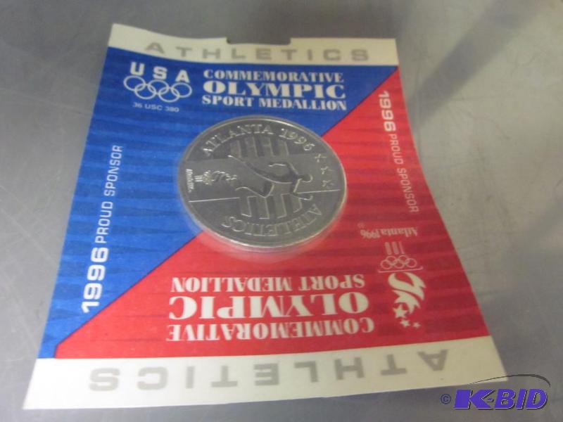 1996 Commemorative Olympic coin in package.&n...